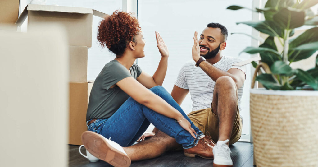 Couple celebrating moving in