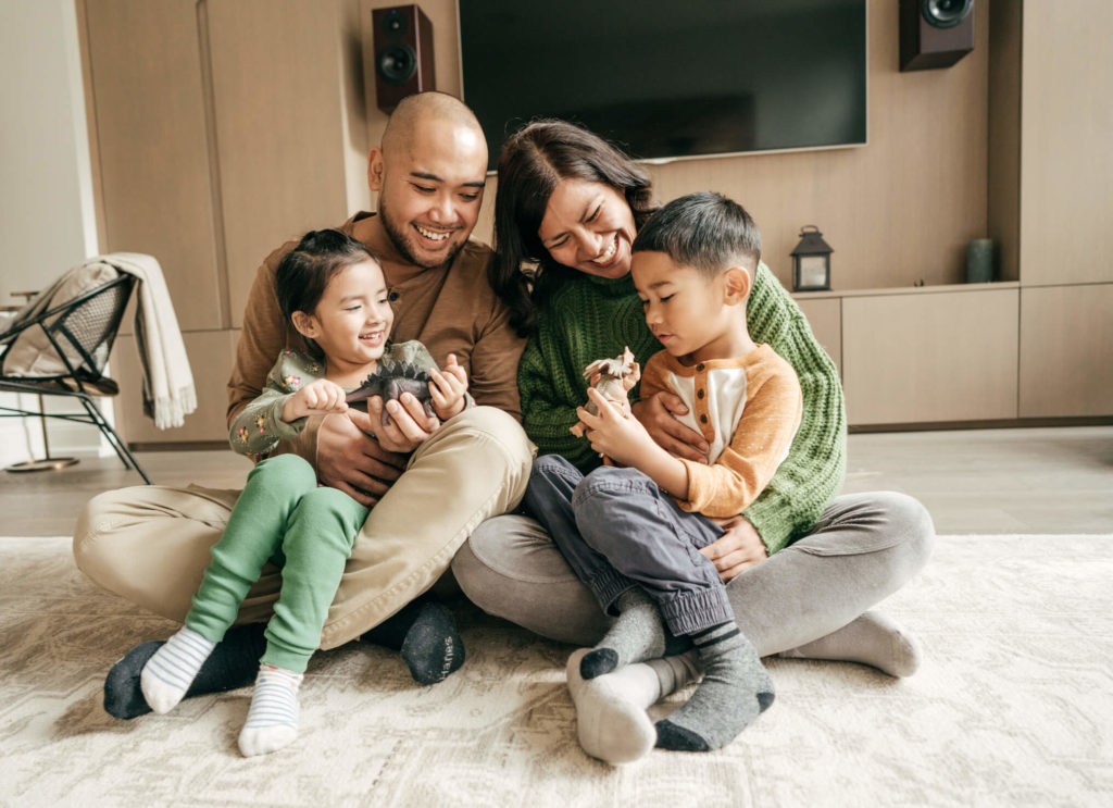 Parents with two children in living room