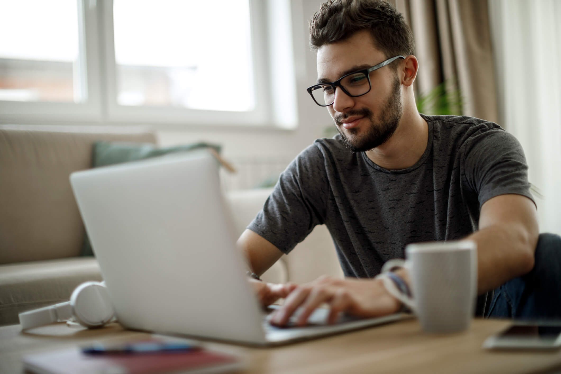 Guy on computer using ExpressVPN