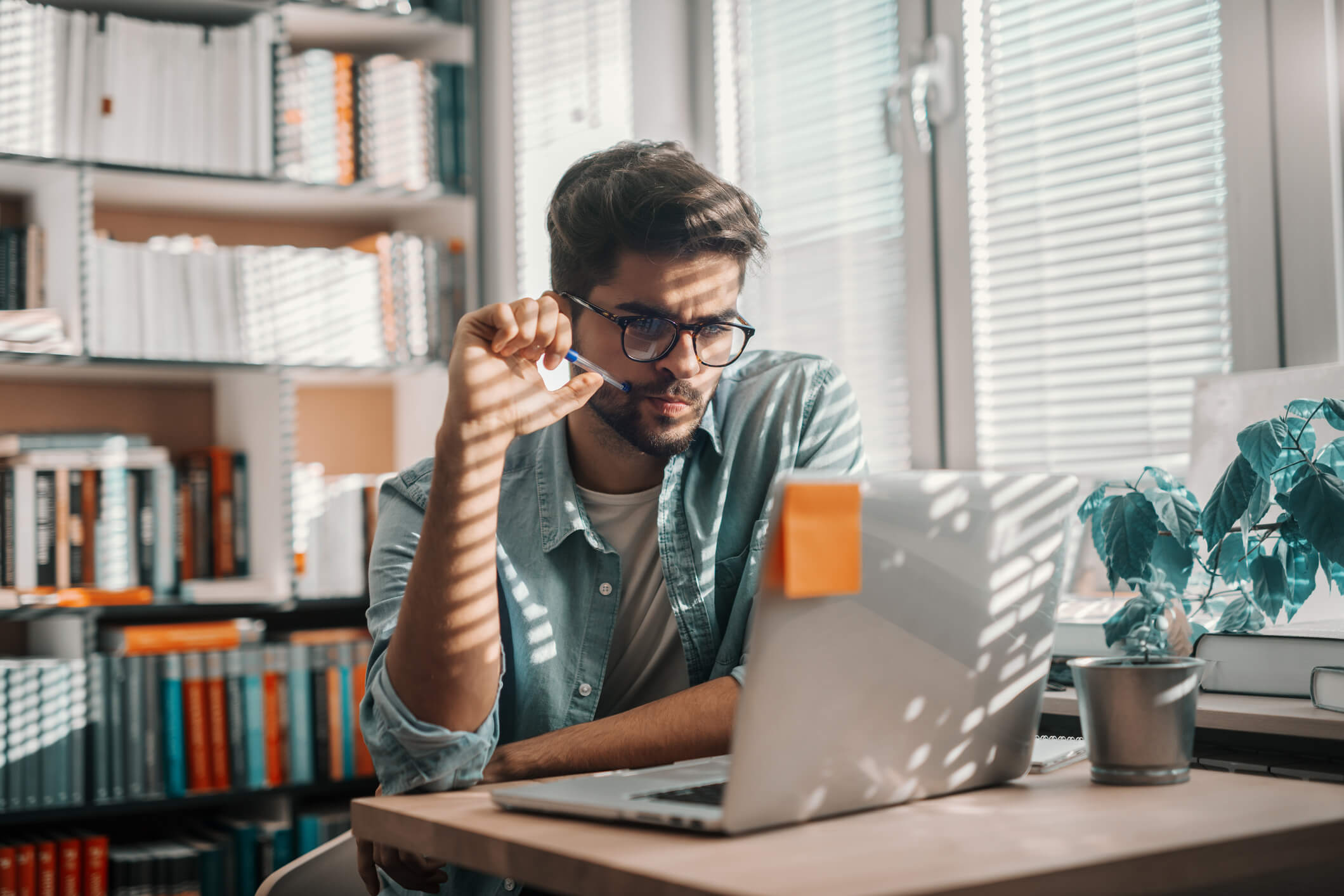 Man on laptop using Windscribe VPN