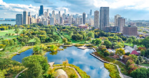 An aerial view of the Chicago skyline showing downtown skyscrapers and Lake Michigan.