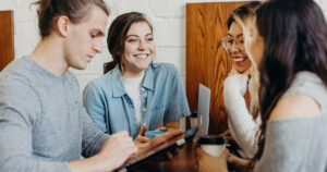 Stock photograph of young group of people using the internet