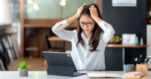 Stock photograph of a woman having NBN internet issues