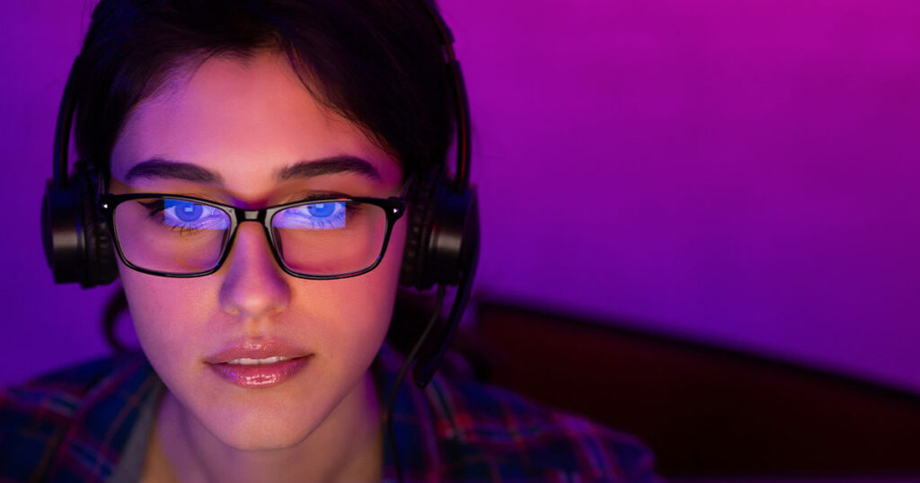 Stock photograph of a woman using a laptop with superfast internet speeds