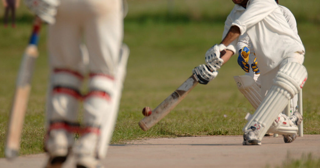 Photograph of people playing Cricket