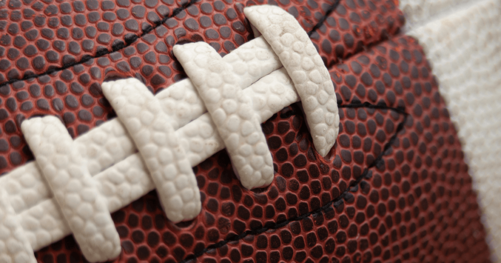 an extreme closeup of a football