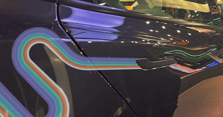 Tesla hidden car door handle with stylised rainbow on image