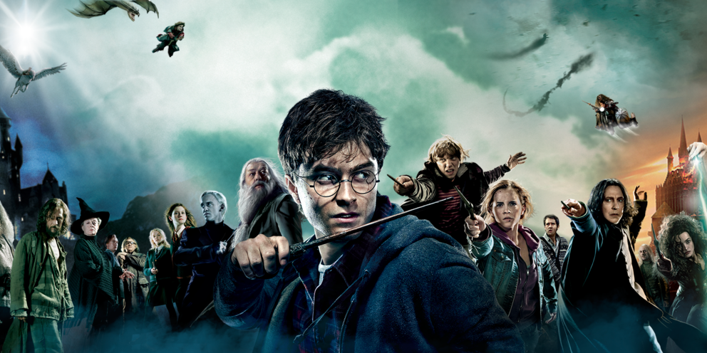 Image from Harry Potter film series featuring the major cast back-to-back with Daniel Radcliffe (Harry Potter) front and centre