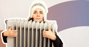 woman in beanie hugging an oil heater, which definitley would be too hot to hold and probably very heavy