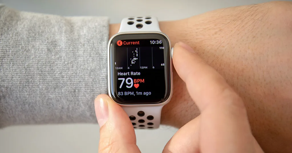 Apple Watch on wrist showing heart rate