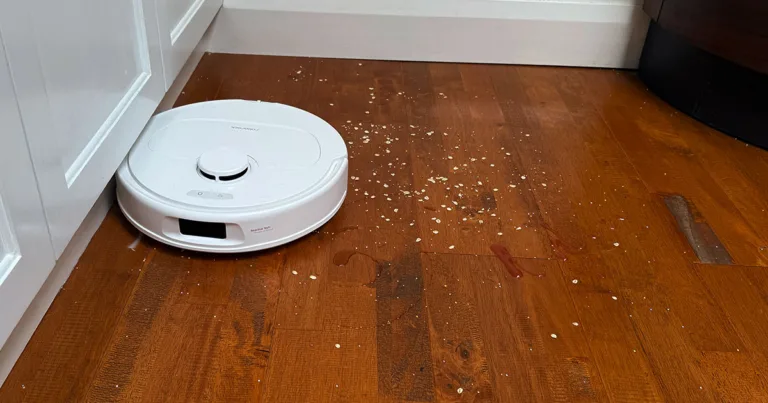 qrevo s vacuuming up oatmeal on hardwood floor